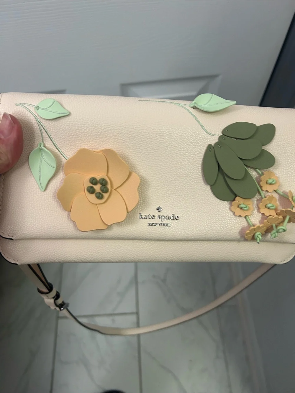 NWOT KATE SPADE floral appliqué leather crossbody bag.